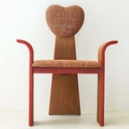 Light brown fabric dining chair with heart-shaped back and creative design