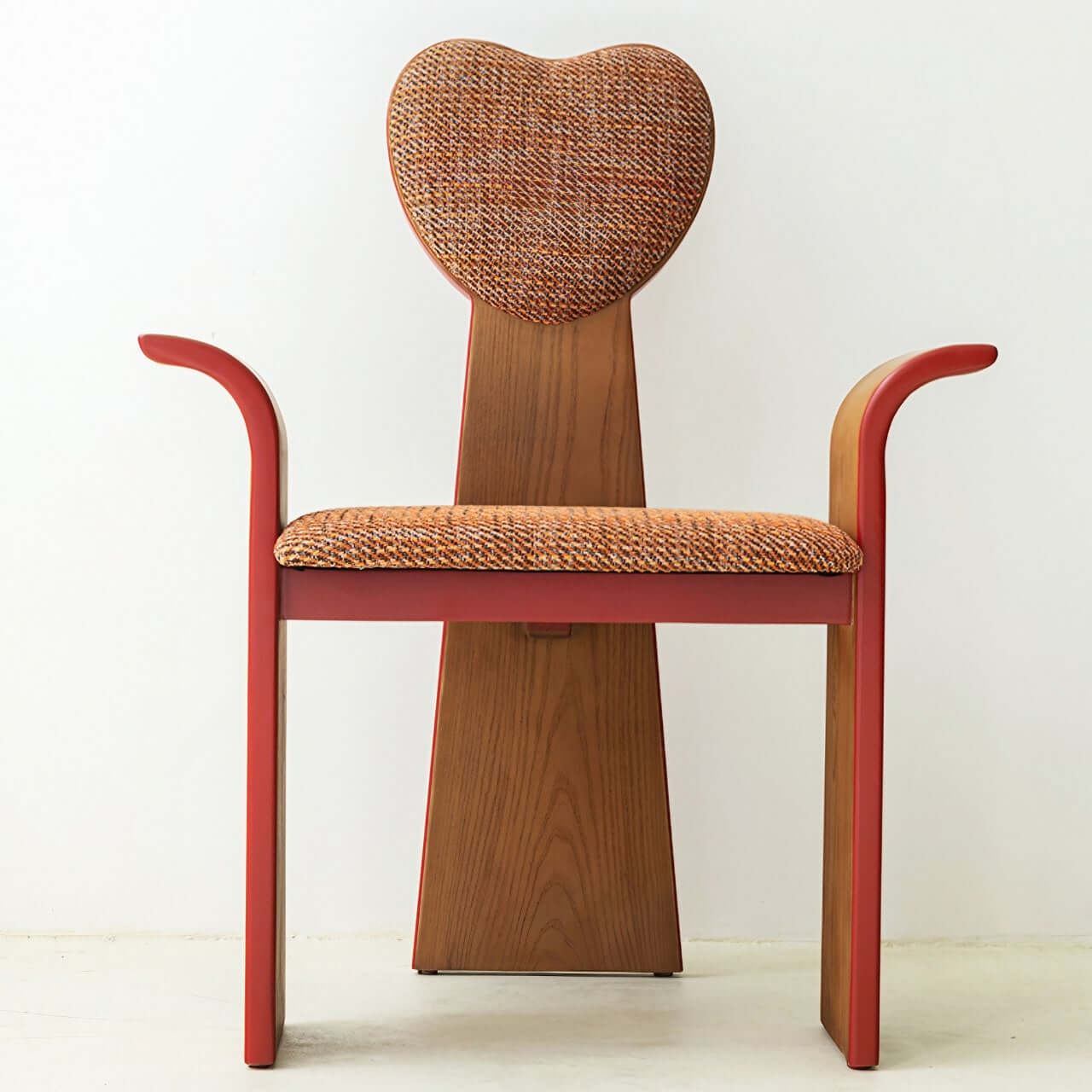 Light brown fabric dining chair with heart-shaped back and creative design
