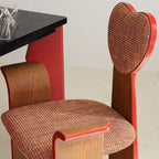 Light brown fabric dining chair with heart-shaped back and creative design