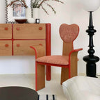 Light brown fabric dining chair with heart-shaped back and creative design