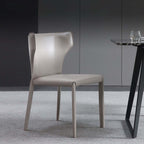 Light khaki saddle leather dining chair with C-shaped curved backrest, minimalist and luxurious design
