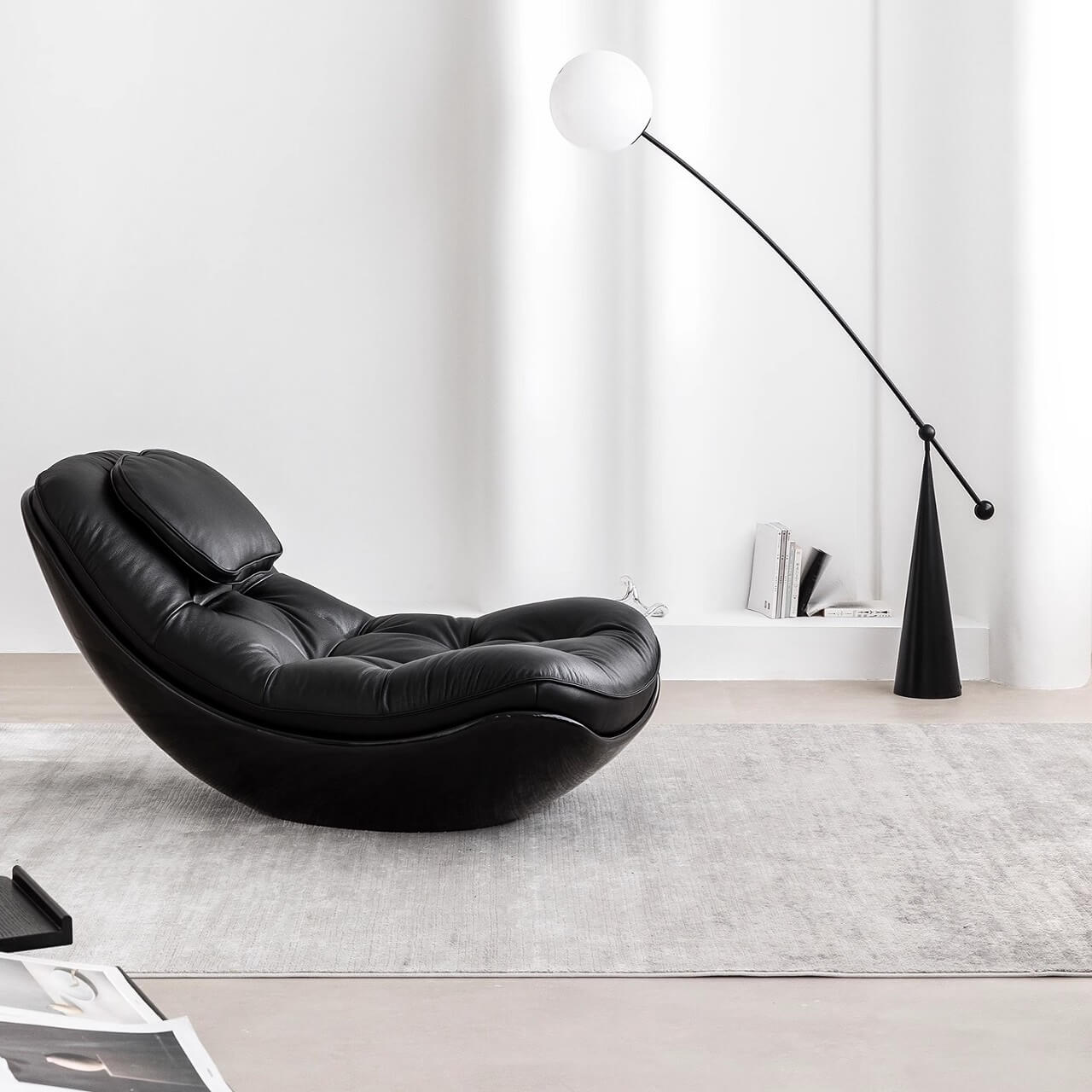 Black microfiber leather recliner chair with unique eggshell shape for luxurious comfort