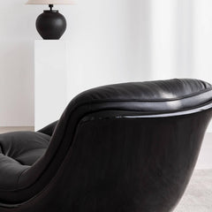 Contemporary black leather sofa with recliner feature