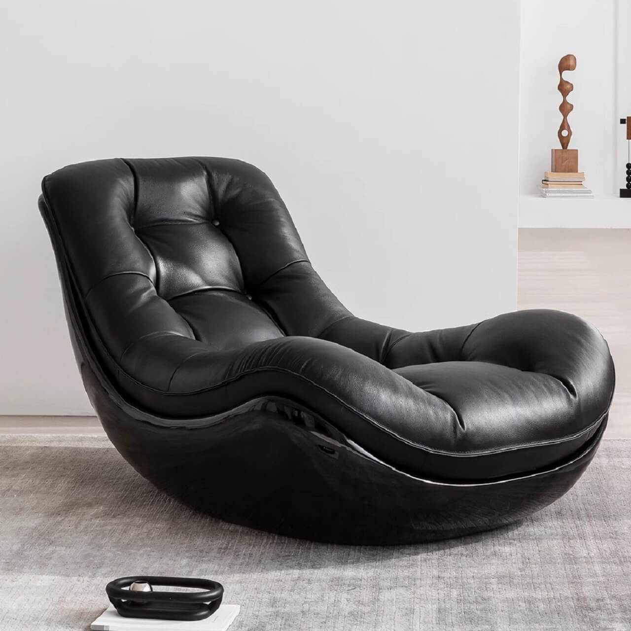 Elegant black microfiber recliner with unique shape