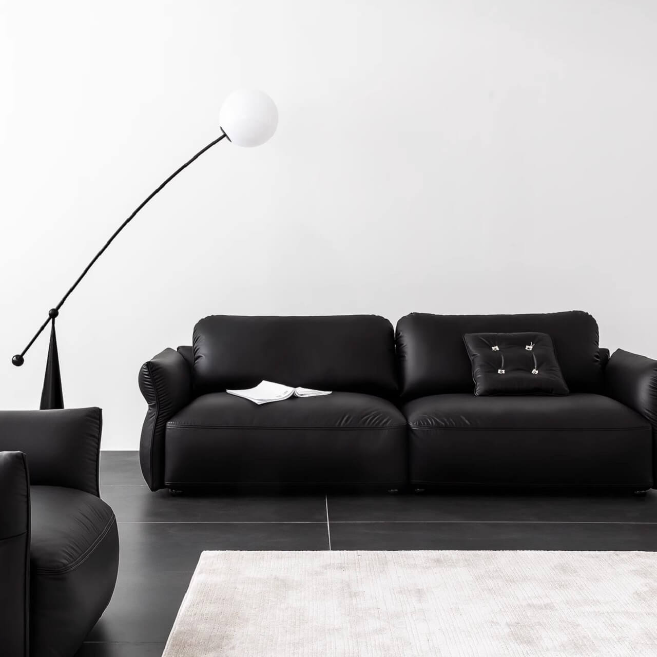 Luxurious black microfiber leather sectional sofa in modern living room