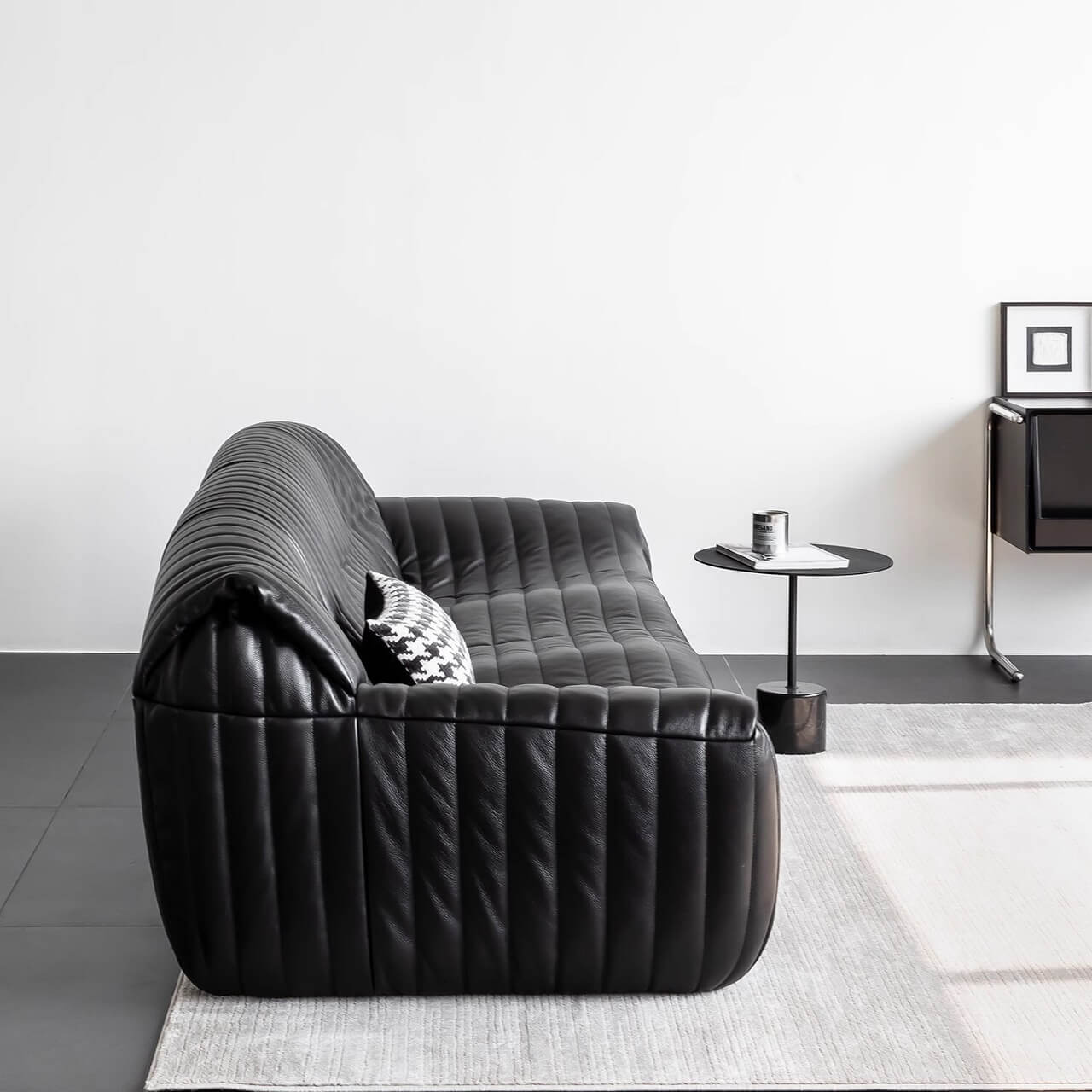 Modern luxurious black sofa in microfiber leather