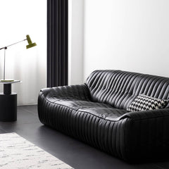 Comfortable four-seater black microfiber leather sofa