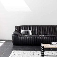 Sophisticated four-seater sofa in black microfiber leather