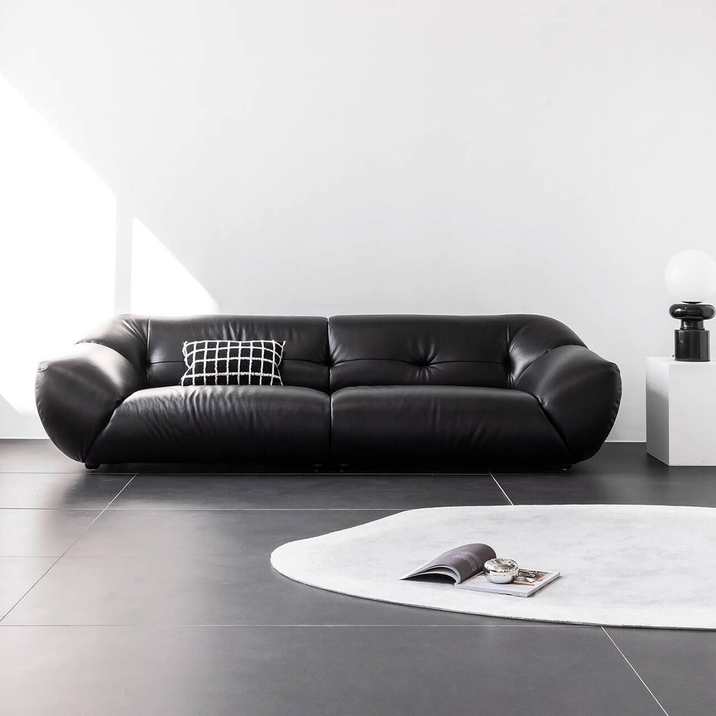 Black microfiber leather sofa with minimalist design, seats three comfortably main product image