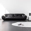 Black microfiber leather sofa with minimalist design, seats three comfortably main product image