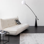 White boucle sofa bed combining comfort, style, and versatility for modern living spaces