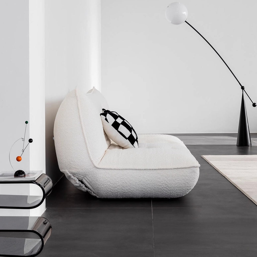 White boucle sofa bed combining comfort, style, and versatility for modern living spaces