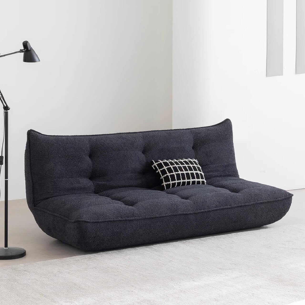 White boucle sofa bed combining comfort, style, and versatility for modern living spaces