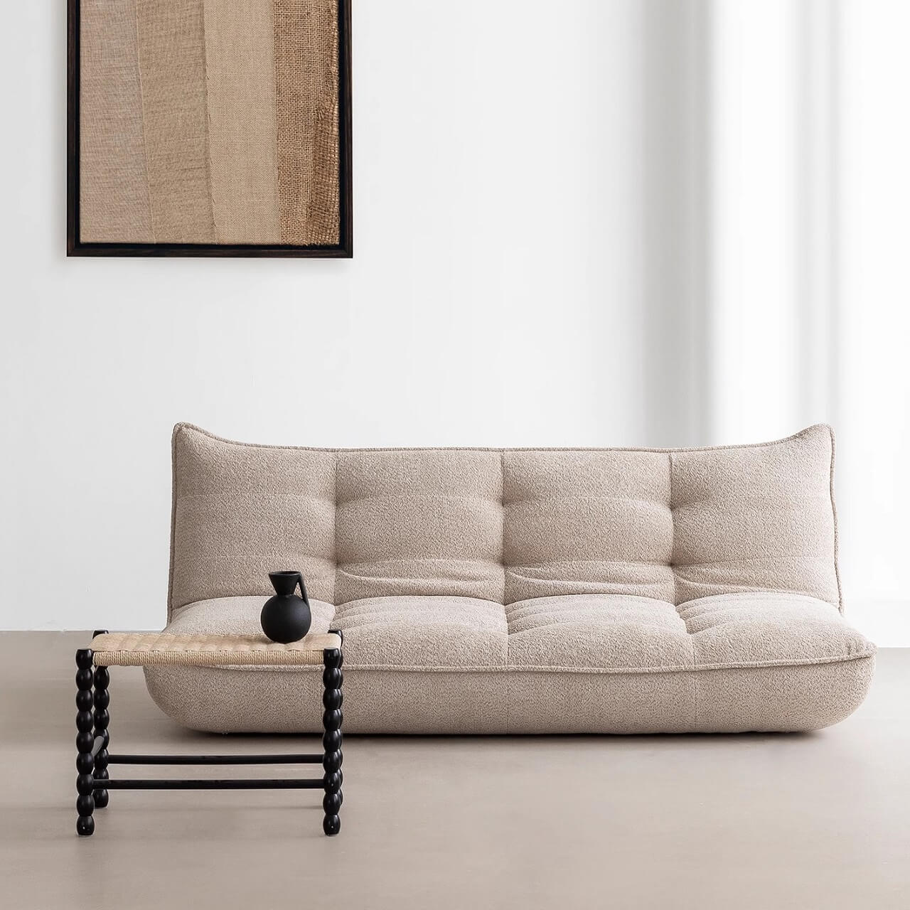 White boucle sofa bed combining comfort, style, and versatility for modern living spaces