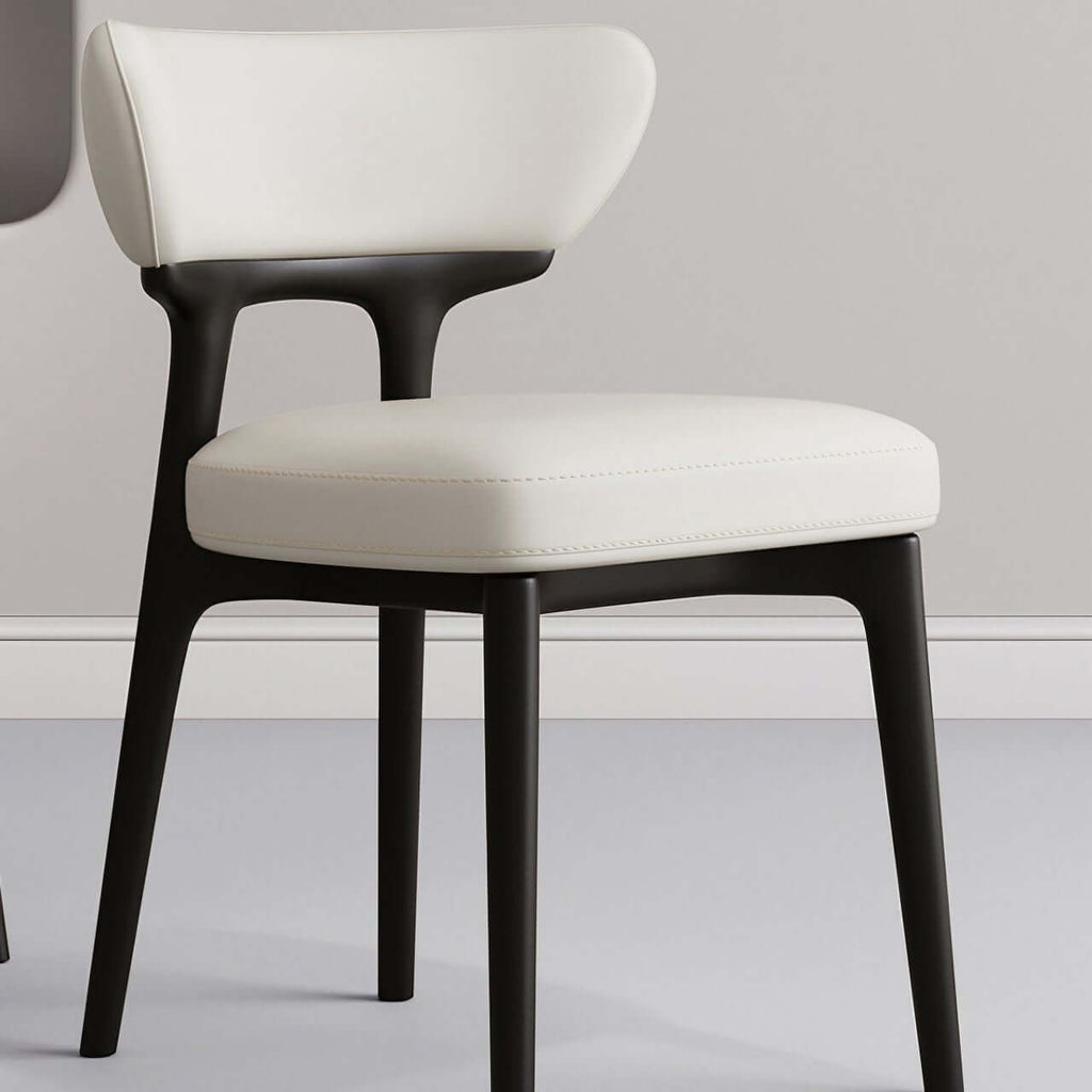 Modern minimalist white dining chair with streamlined back, single seat for stylish comfort