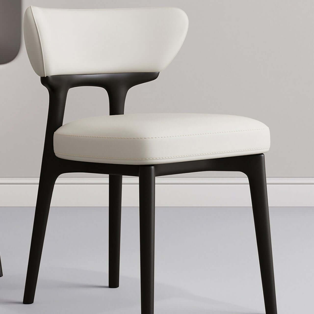 Modern minimalist white dining chair with streamlined back, single seat for stylish comfort