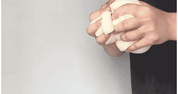 Burnt orange single lounge chair in PU leather with caterpillar design, Togo sofa style