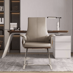 Modern minimalist gray leather armchair with silver metal legs for elegant and functional workspace design