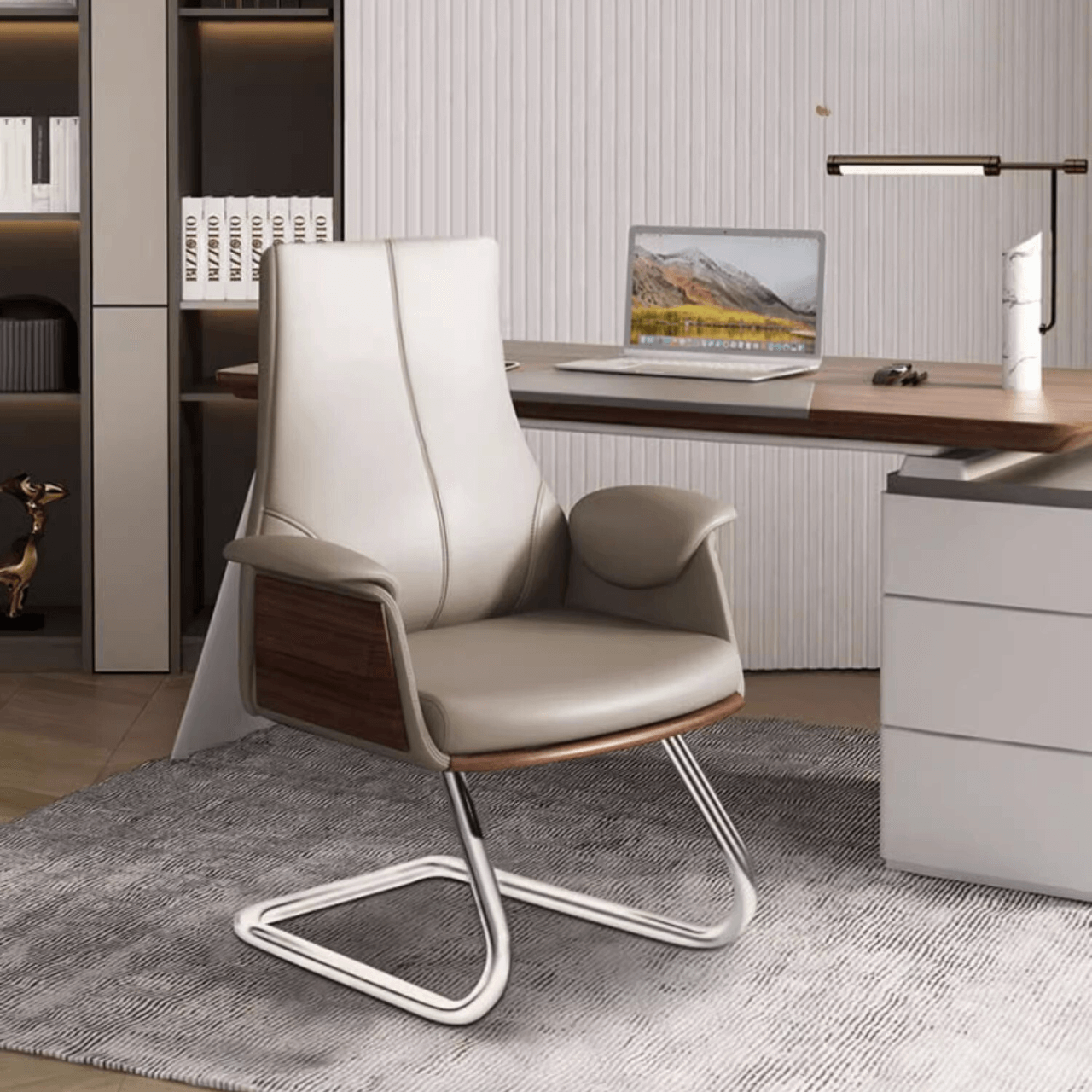 Chic gray leather office chair with flared arms and silver metal legs for sophisticated and professional work environments