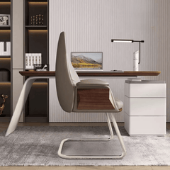 Elegant gray leather arc-shaped office chair with flared arms and silver metal legs for executive office settings