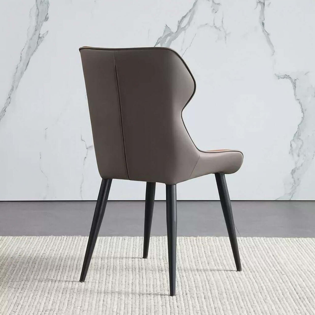 Light grey high-back dining chair with durable leather, minimalist luxury design