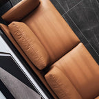 Orange microfiber leather sofa with minimalist design, sleek style, and 88.58-inch length for comfortable seating