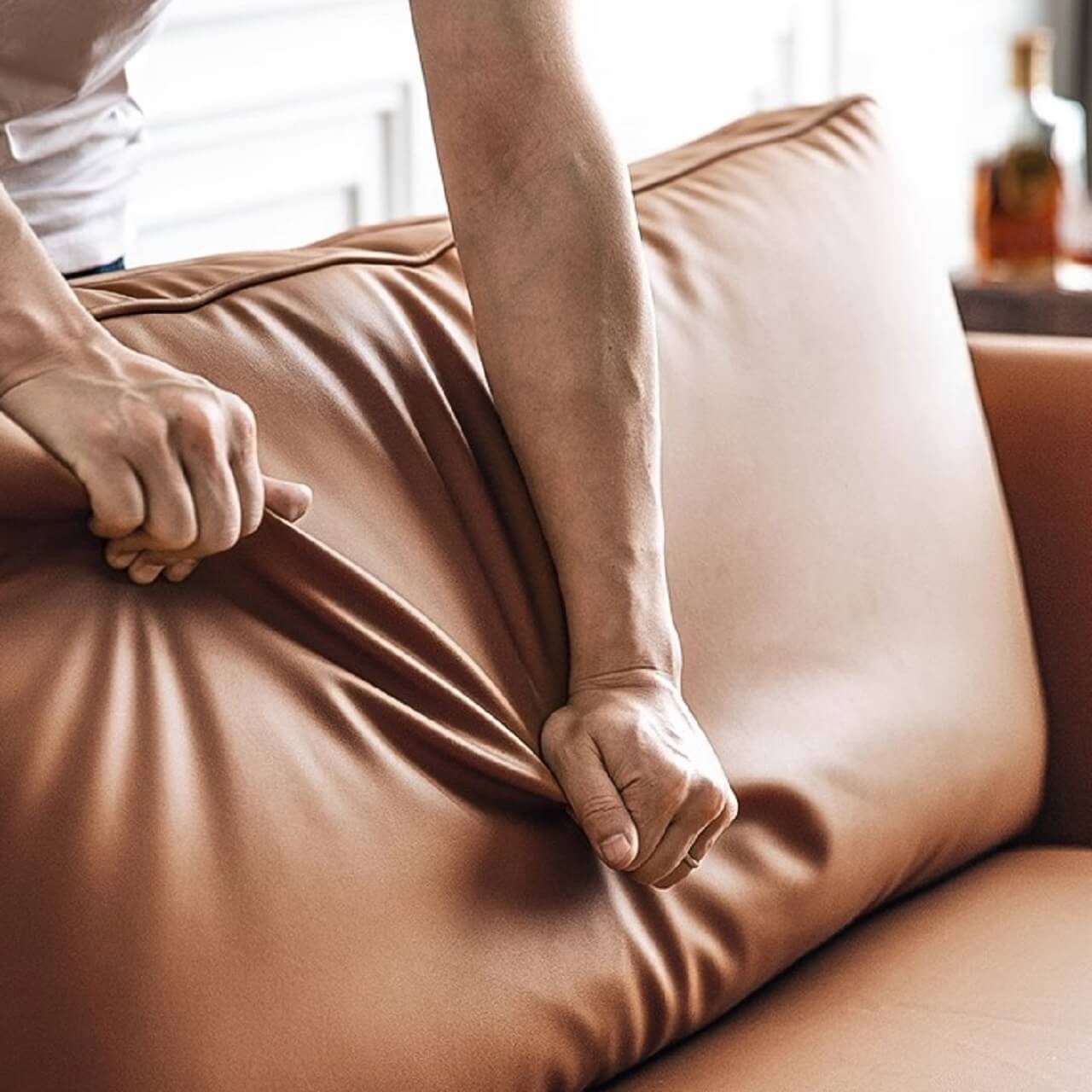 Orange microfiber leather sofa with minimalist design, sleek style, and 88.58-inch length for comfortable seating