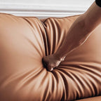 Orange microfiber leather sofa with minimalist design, sleek style, and 88.58-inch length for comfortable seating