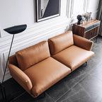Orange microfiber leather sofa with minimalist design, sleek style, and 88.58-inch length for comfortable seating