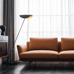 Minimalist orange microfiber leather sofa in a modern living room