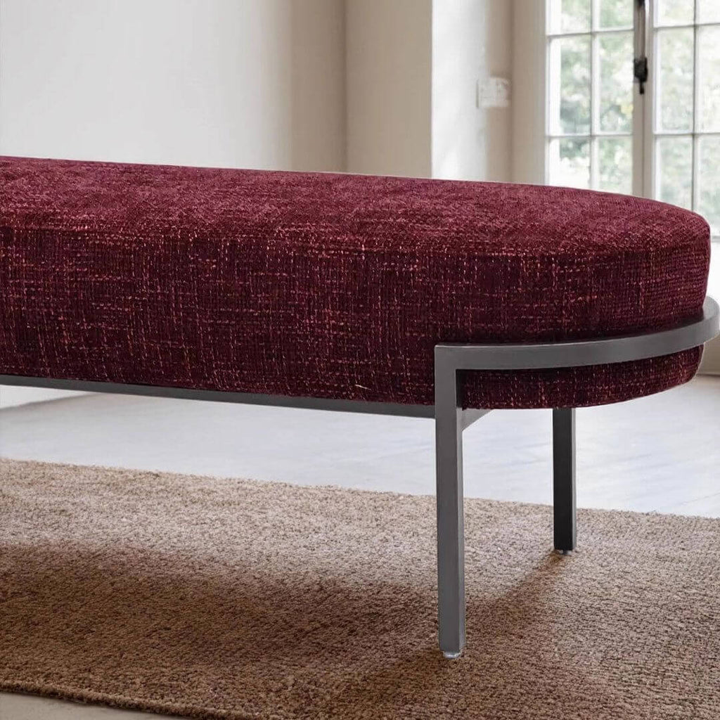 Minimalist Solid-Color Upholstered Bench Featuring Elliptical Silhouette and Floating Metal Base