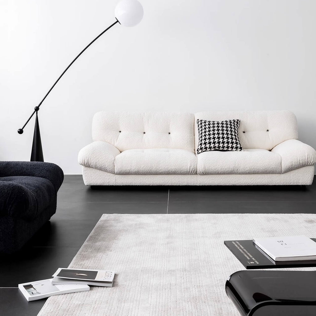 White minimalist boucle sofa with solid wood frame and elegant flared arms main product image