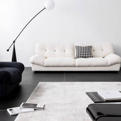 Elegant minimalist white boucle sofa with wooden frame