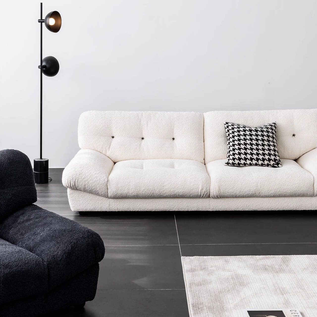 White minimalist boucle sofa with solid wood frame and elegant flared arms
