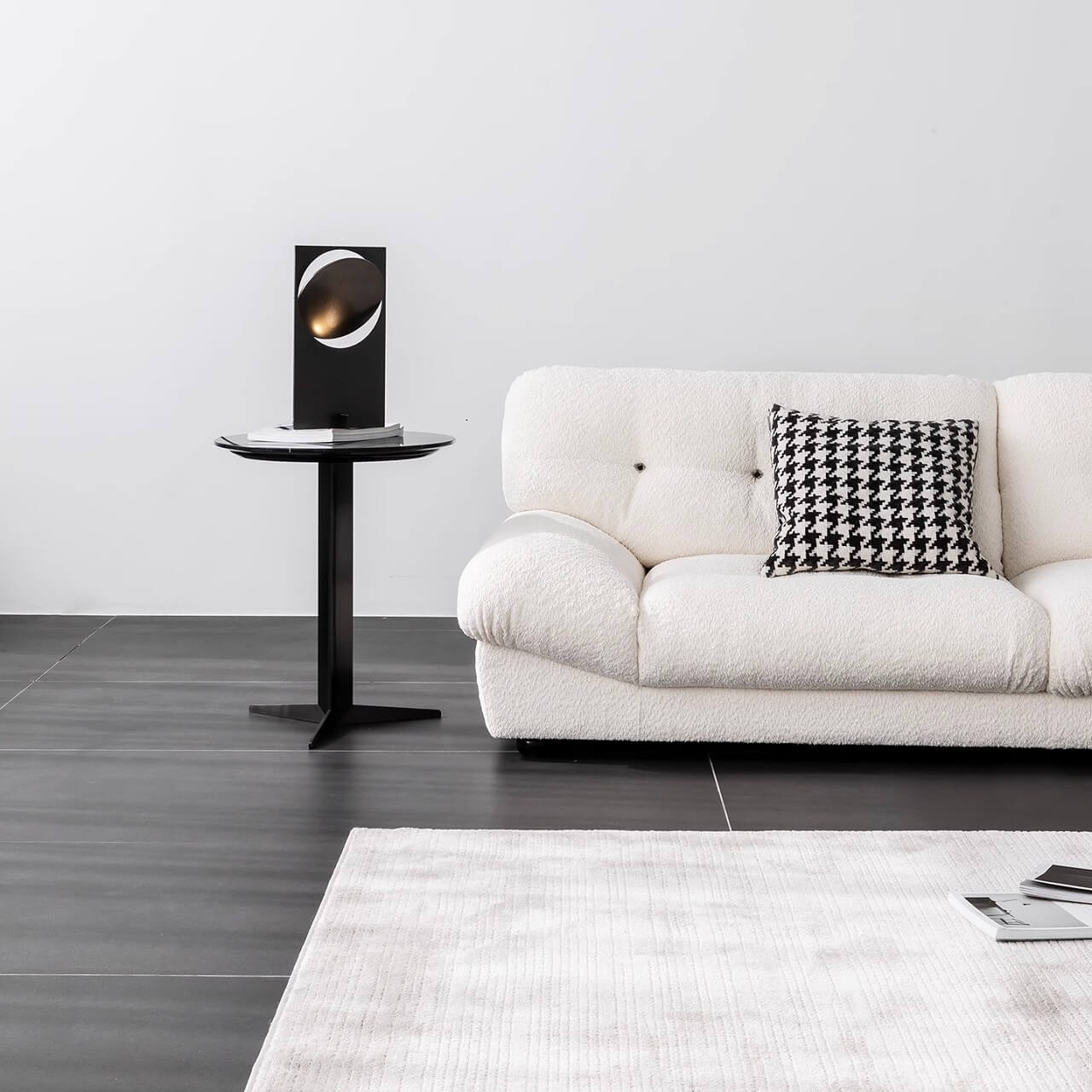 White minimalist boucle sofa with solid wood frame and elegant flared arms