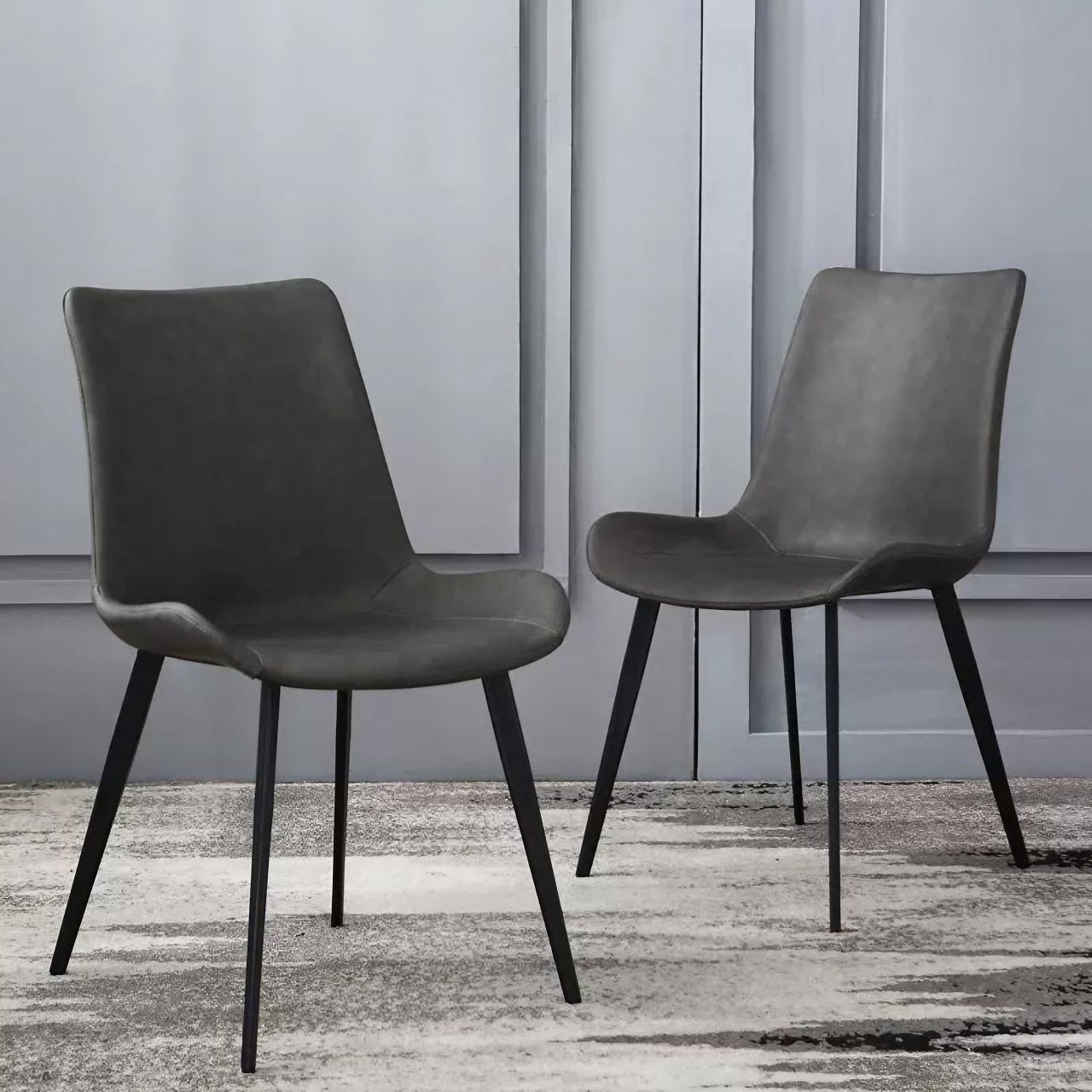 Modern black faux leather high-back chair with minimalist design for contemporary interiors