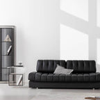 Black faux leather sofa bed with stainless steel frame and pillow arms for modern living rooms