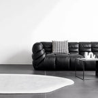 Black microfiber leather sectional sofa with solid wood frame, modern design for living room