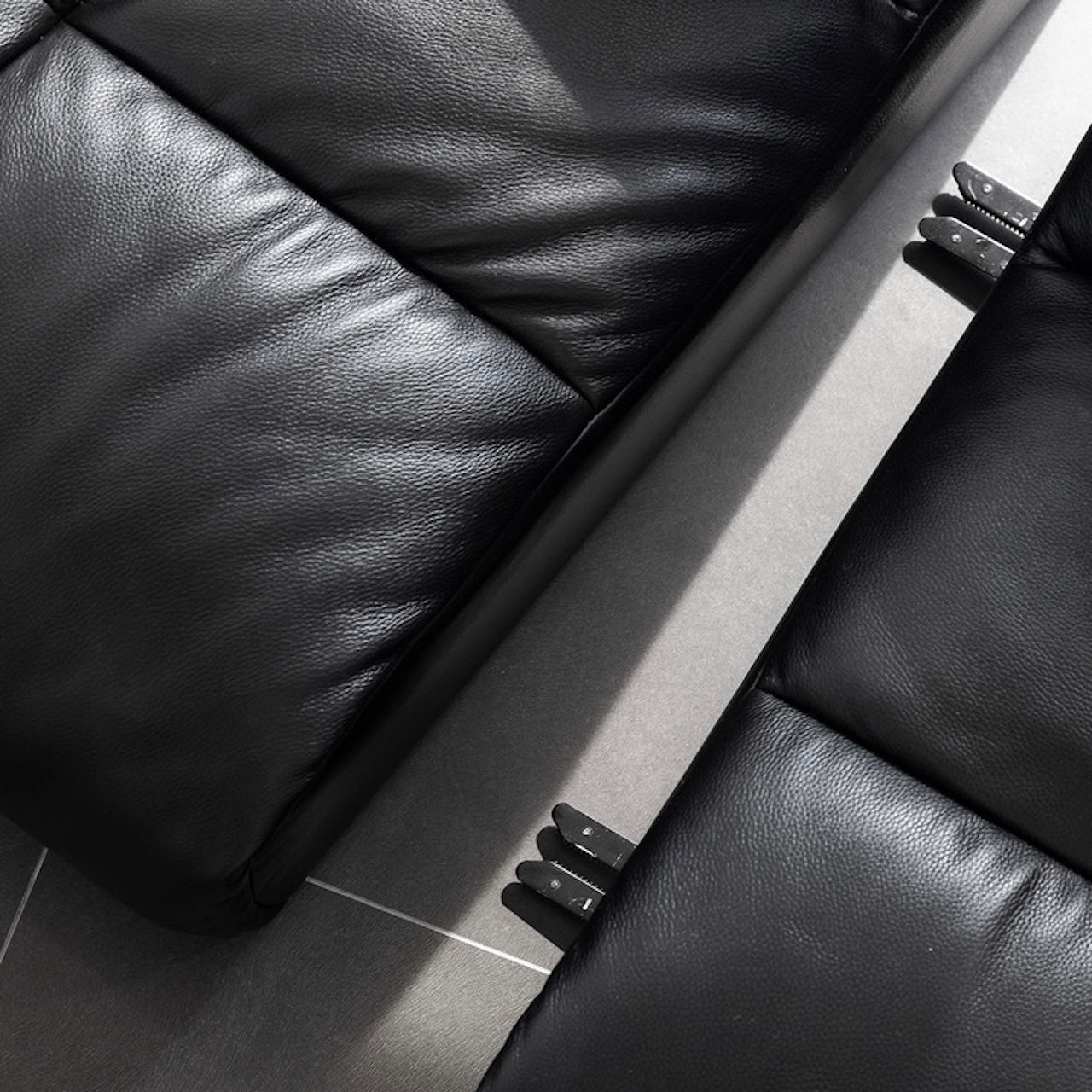 Black microfiber leather sectional sofa with solid wood frame, modern design for living room