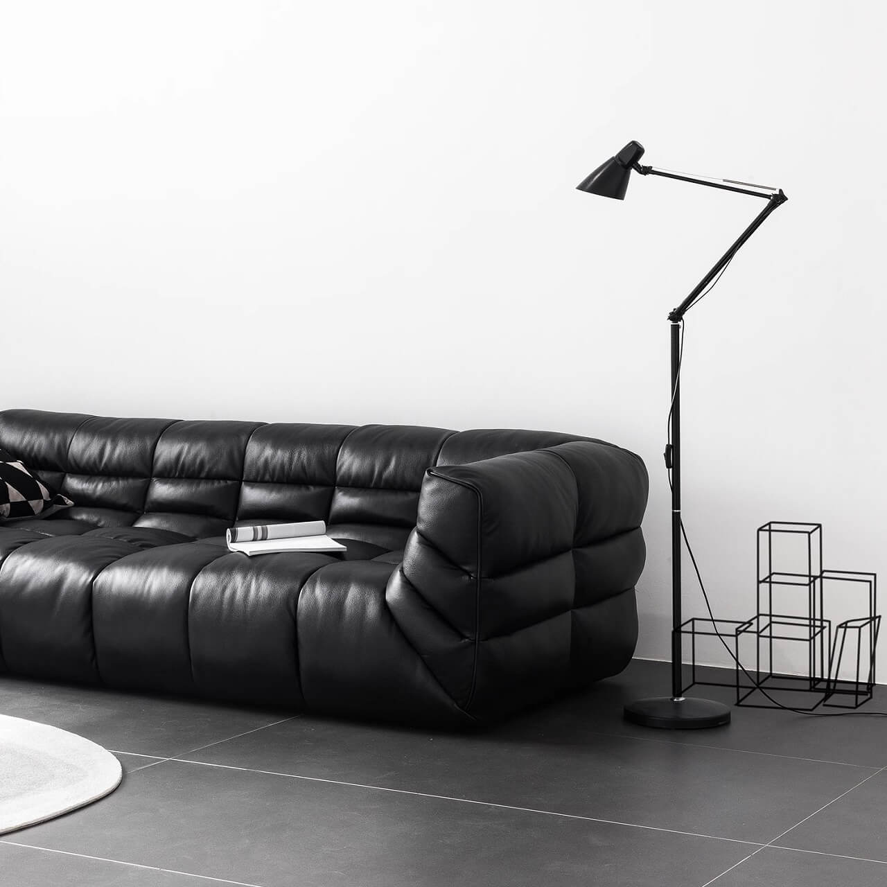 Black microfiber leather sectional sofa with solid wood frame, modern design for living room