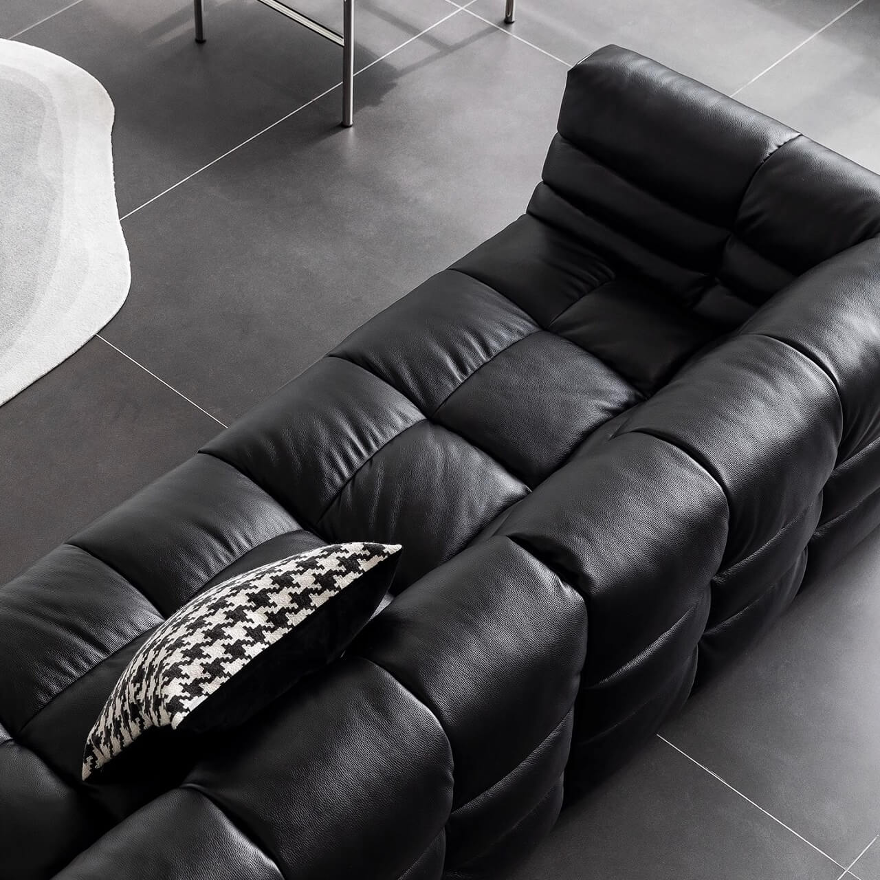 Black microfiber leather sectional sofa with solid wood frame, modern design for living room