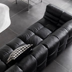 Black microfiber leather sectional sofa with solid wood frame, modern design for living room