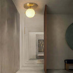 Modern Glass Globe Ceiling Light with Gold Finish and Ambient Glow