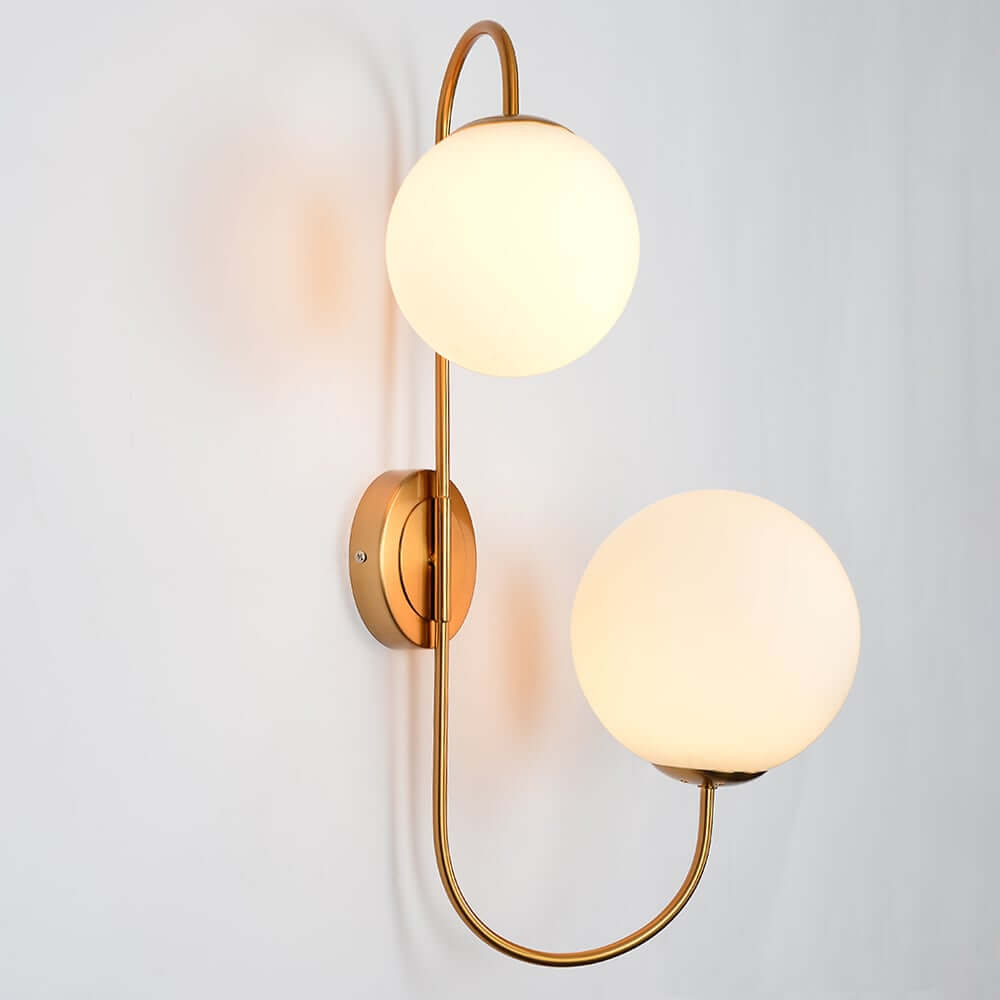 Modern Gold Armed Wall Sconce with Dual White Glass Globes