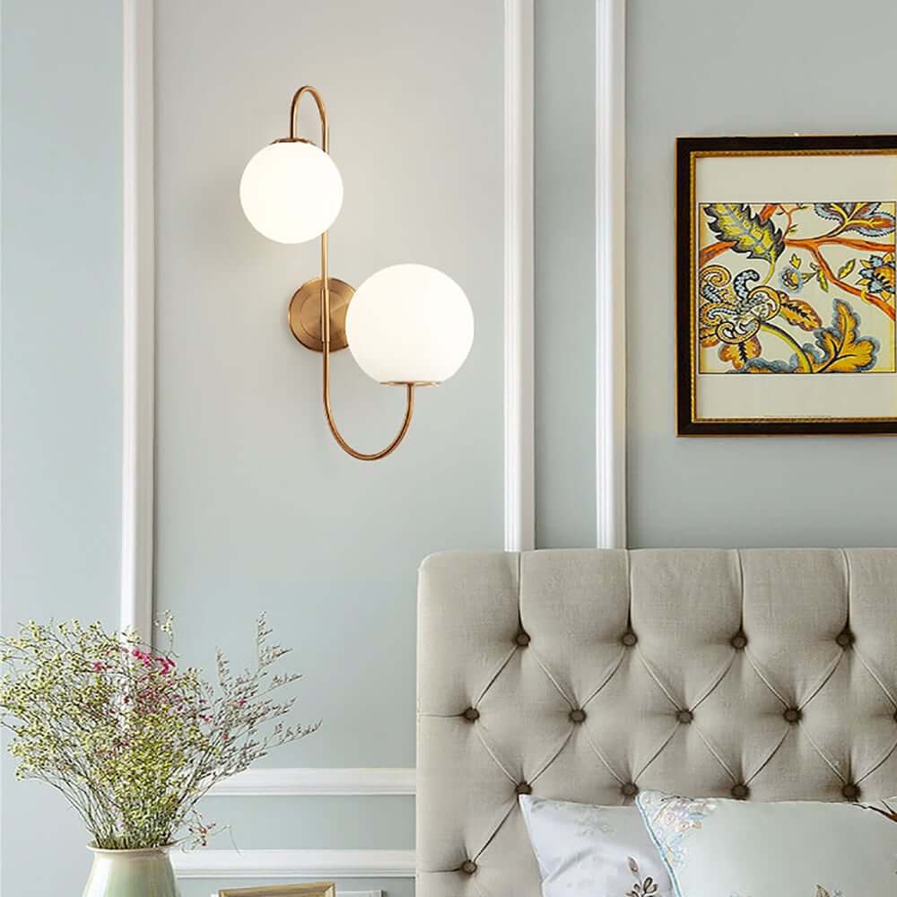 Modern Gold Armed Wall Sconce with Dual White Glass Globes