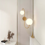 Modern Gold Armed Wall Sconce with Dual White Glass Globes