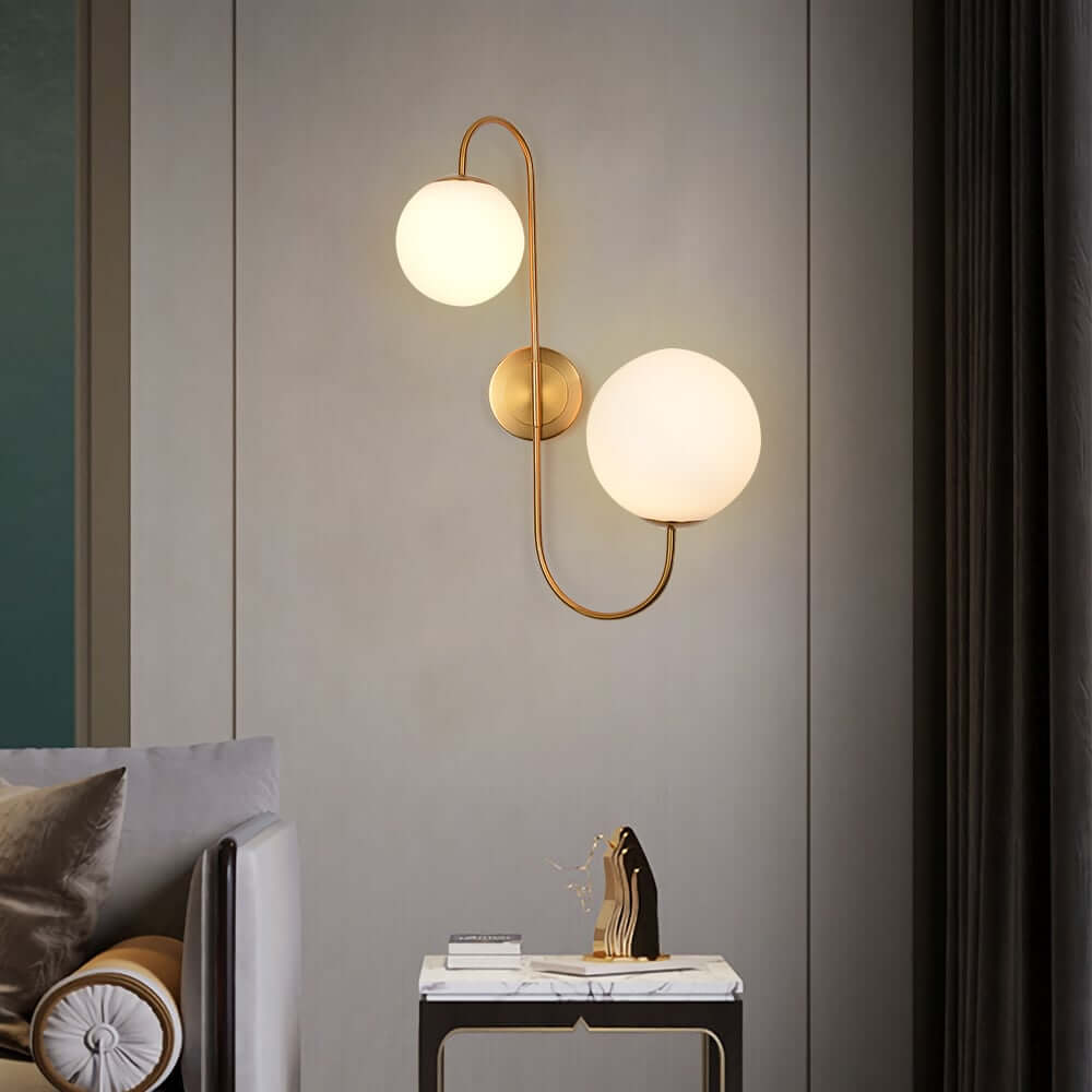 Modern Gold Armed Wall Sconce with Dual White Glass Globes Main Product Image Main image