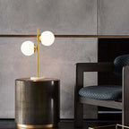 Modern Gold-Finish Faux Marble Table Lamp with 2 White Glass Globes