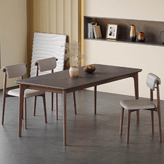 Elegant modern gray dining table with rock slab surface and solid wood support