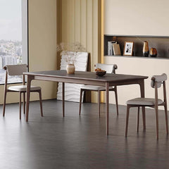 Sophisticated rectangular dining table with gray rock slab and wooden legs